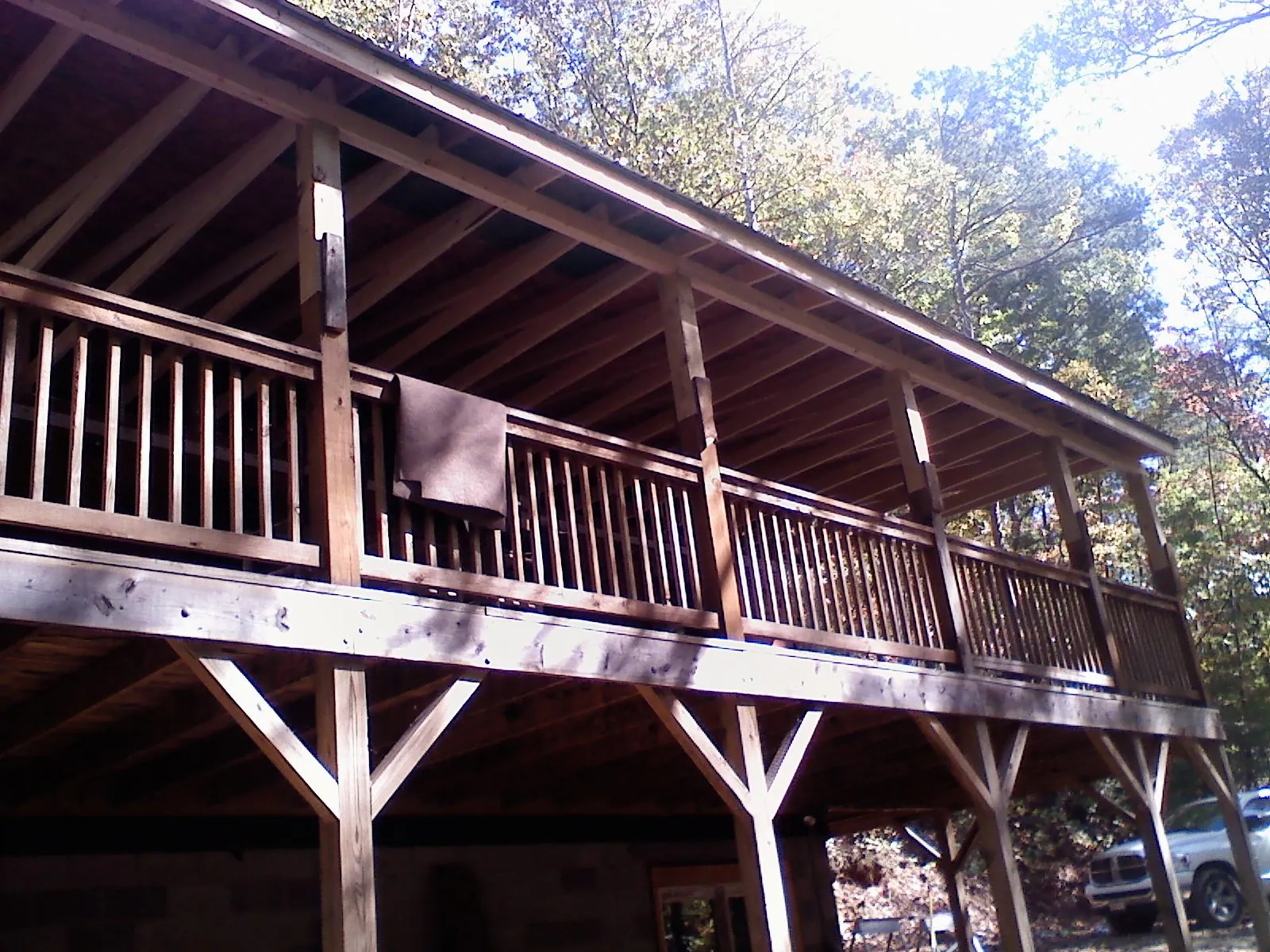 Timber framing under a new elevated porch and deck — Roof Leak Repair in Barre by Roofing Brothers
